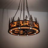 Tall Pines Chandel-Air illuminating rustic space with warm amber light.
