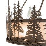 Side detail of illuminated pine trees and metal cutout design.
