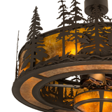 Closeup showing pine tree silhouettes and glowing amber mica diffuser.