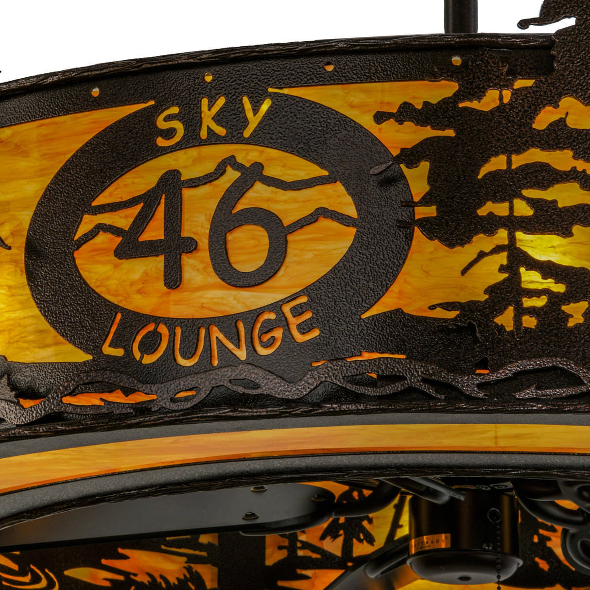 Closeup of Sky Lounge 46 logo illuminated through amber Idalight shade.