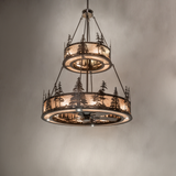 Rustic Tall Pines chandelier fan glowing against neutral wall background.