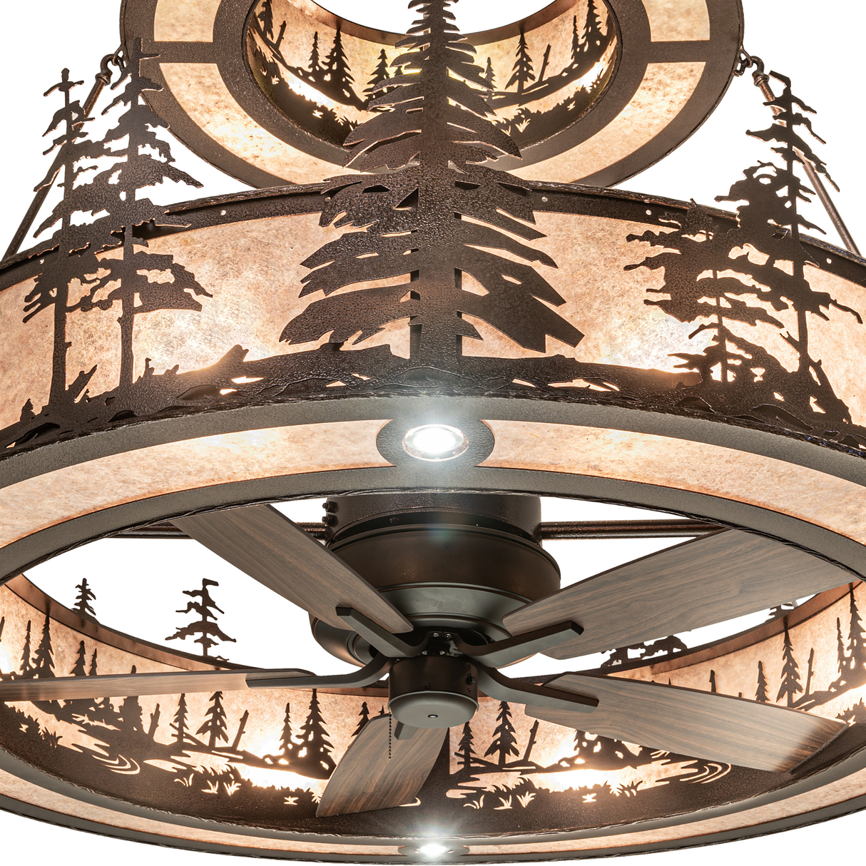 Close-up of Tall Pines chandelier showing intricate pine details and fan.