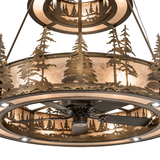 Close-up of lower tier pine cutouts illuminated through mica shade.