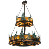 Tall Pines Two Tier Chandel-Air with glowing amber mica diffusers and pine tree silhouettes.