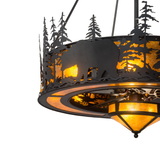 Angled lit view revealing layered pine forest design and warm glow.