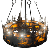 Top angled lit view highlighting tree cutouts and amber mica panels.