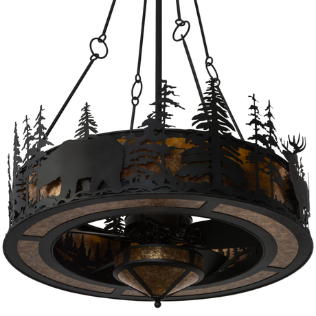 Unlit front view showing black metal pine and wildlife silhouettes.