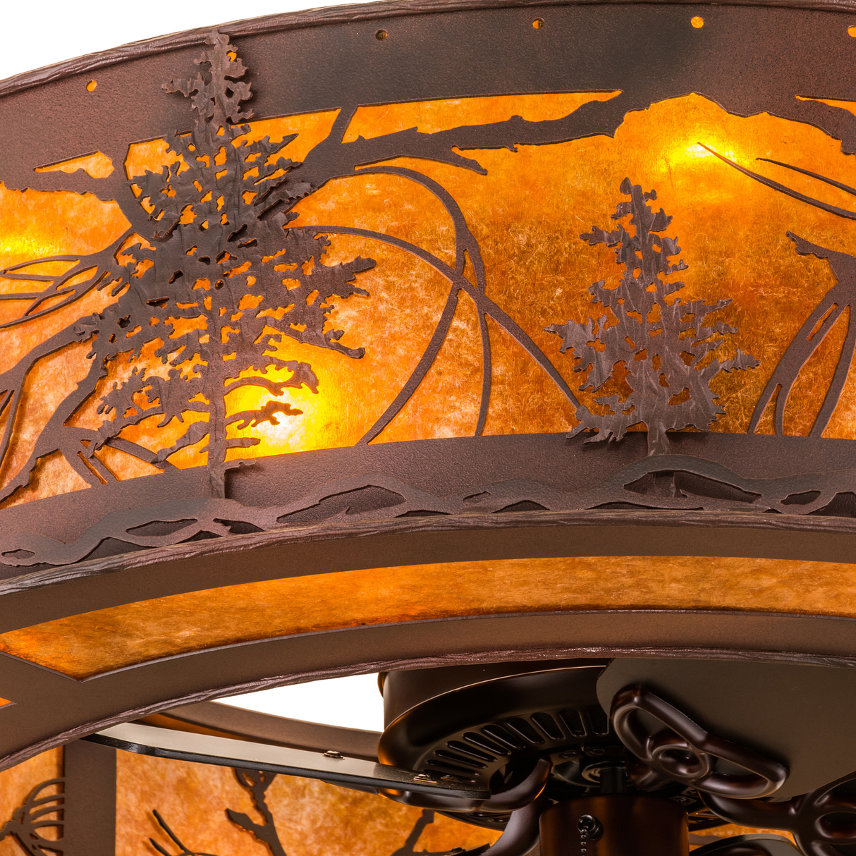 Closeup of intricate pine tree cutouts and mica diffuser texture.