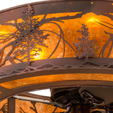 Closeup of intricate pine tree cutouts and mica diffuser texture.