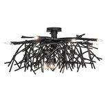 Side view of chandelier showing branch-style metal framework with exposed candle bulbs.