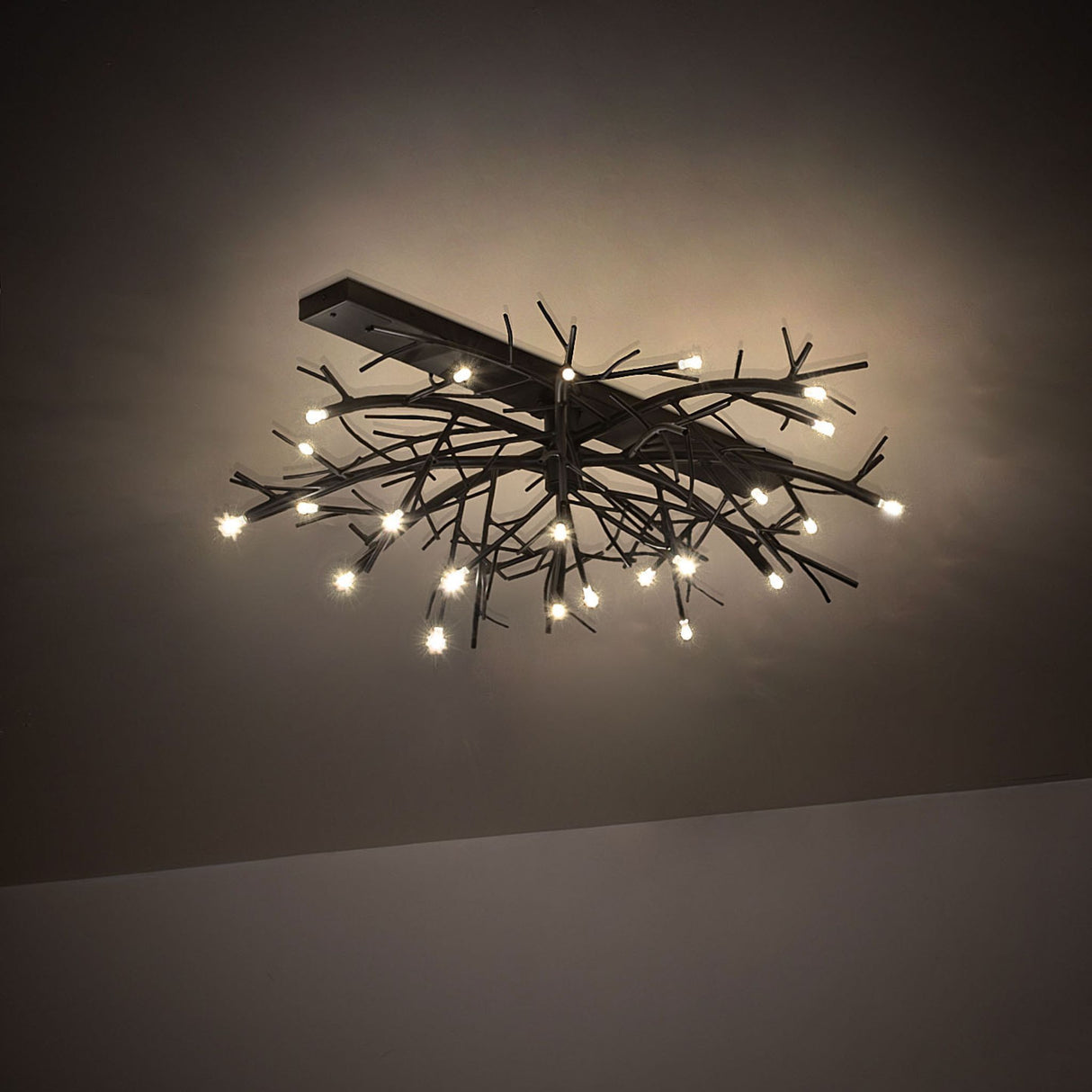 Thicket chandelier creating soft ambient lighting with clustered branch-style metal arms.