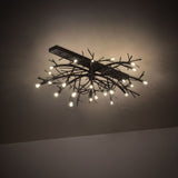 Thicket chandelier creating soft ambient lighting with clustered branch-style metal arms.