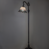 Angelica stained glass floor lamp glowing in ambient light.