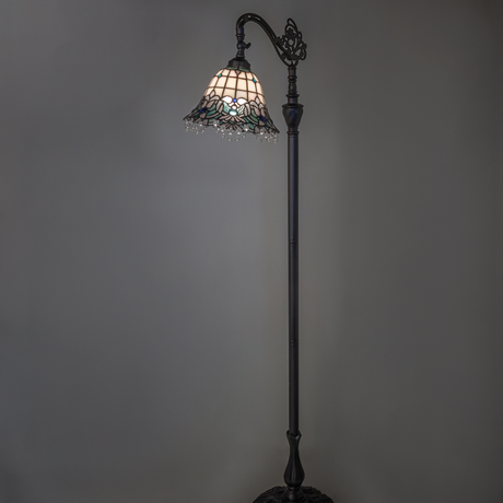 Angelica stained glass floor lamp glowing in ambient light.