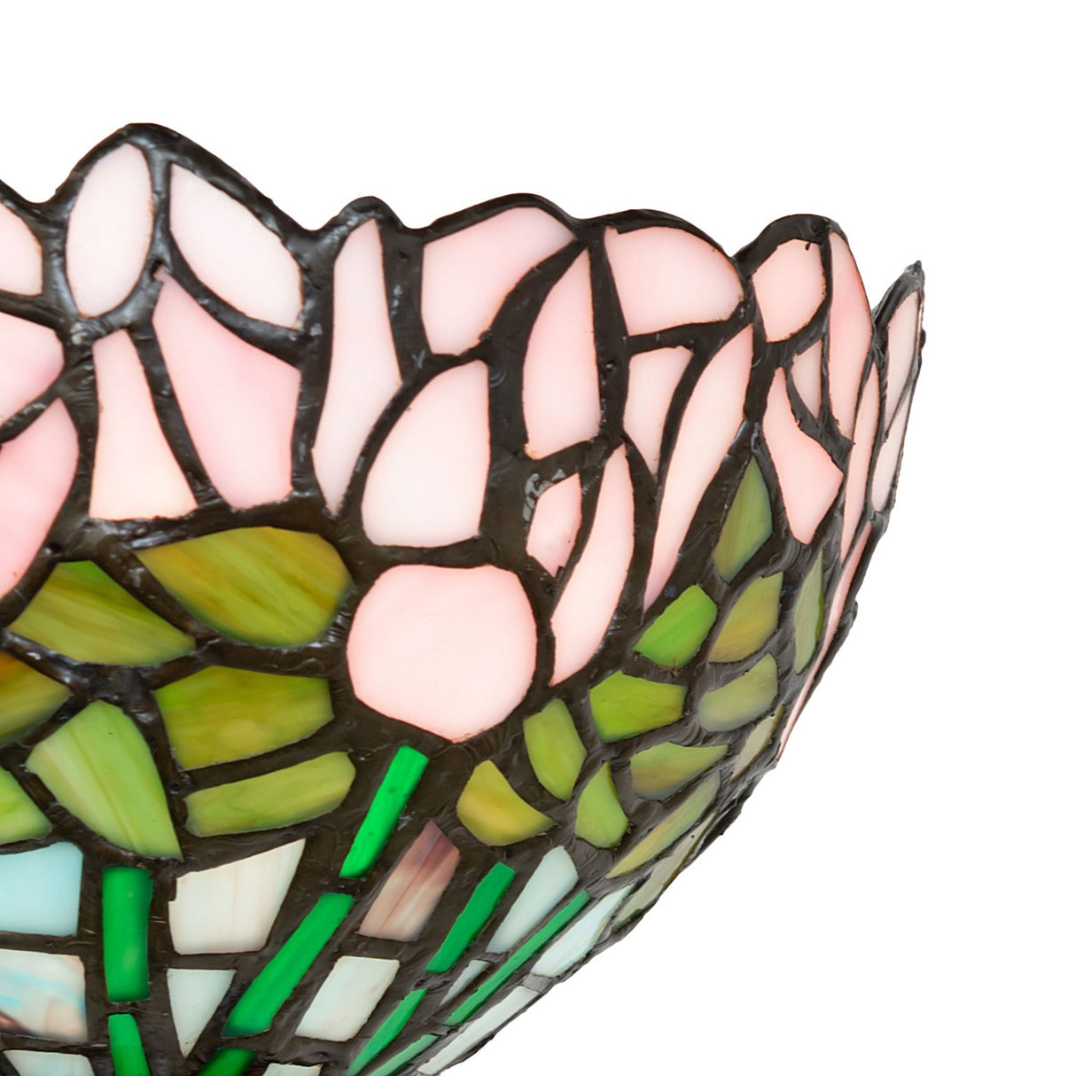 Close-up of pink and green floral stained glass on wall sconce.
