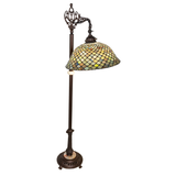 Angled view of Tiffany Fishscale bridge arm lamp with bronze base.