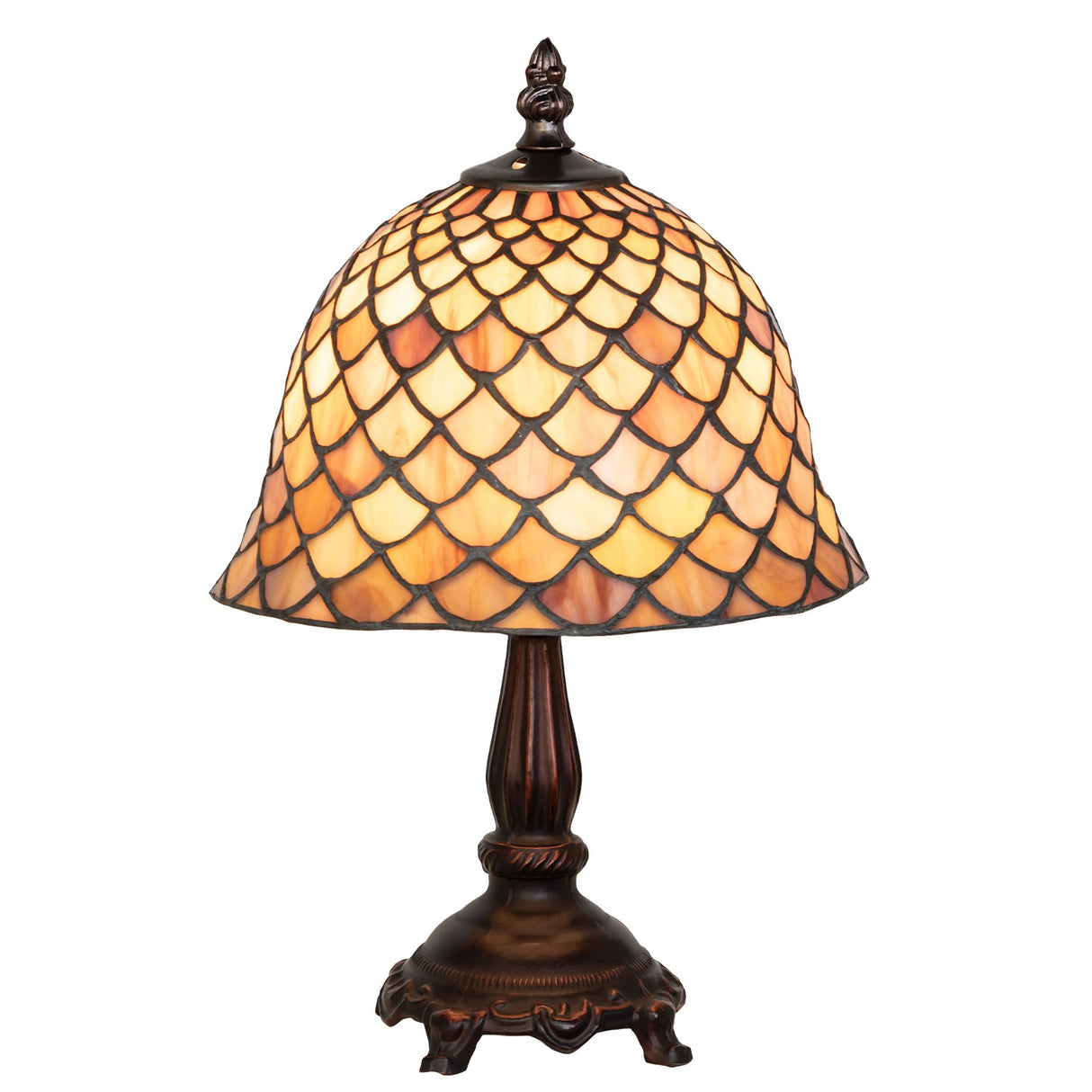lit view of tiffany fishscale mini lamp casting a warm and inviting glow.