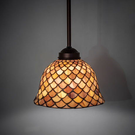 Illuminated Tiffany Fishscale Mini Pendant casting warm light.