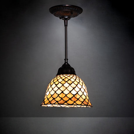 Tiffany Fishscale Mini Pendant illuminated in a dim setting.