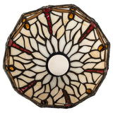 Bottom view of dragonfly shade with intricate stained-glass design.