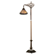 Jeweled peacock Tiffany bridge arm floor lamp with lit stained glass shade.