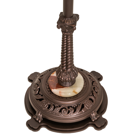 Close-up of ornate lionfoot base with carved detailing and marble accent.