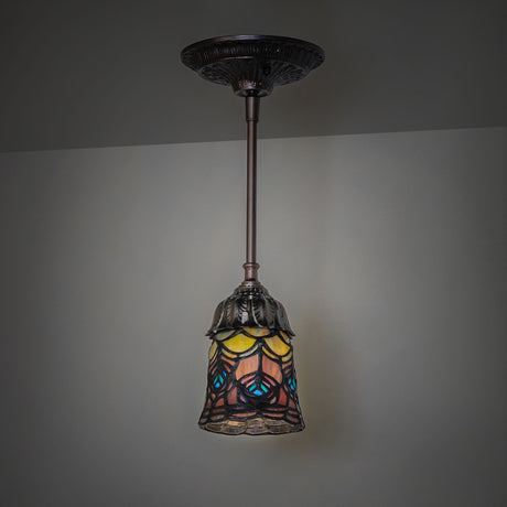 Dark room ambiance with Tiffany Peacock Feather Mini Pendant emitting warm light.