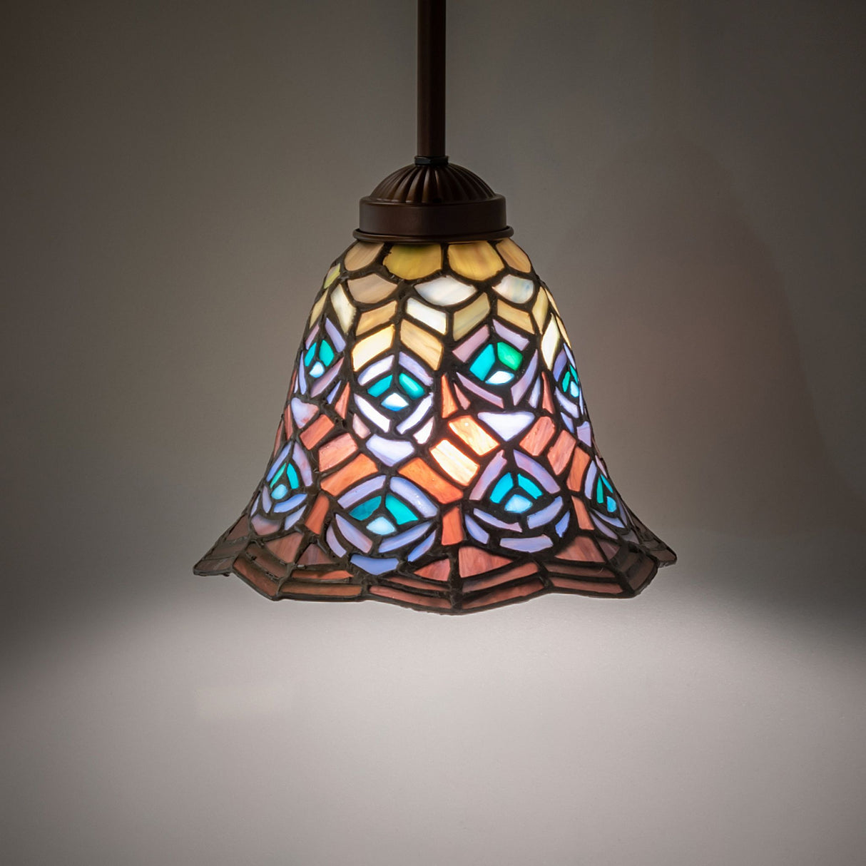 Illuminated Tiffany Mini Pendant with colorful stained glass.