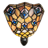 Tiffany-style peacock feather night light illuminated with warm glow.