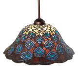 Side view of the Tiffany Peacock Feather Pendant with a clear display of its colorful design.