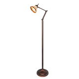 Tiffany-style Prairie Mission floor lamp with stained glass shade illuminated.
