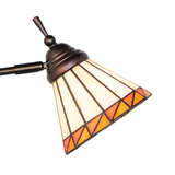 Close-up of stained glass lamp shade with geometric patterns.