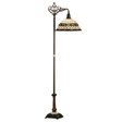Roman-style Tiffany bridge arm floor lamp with lit jeweled art glass shade.