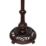 Detailed close-up of decorative metal base.