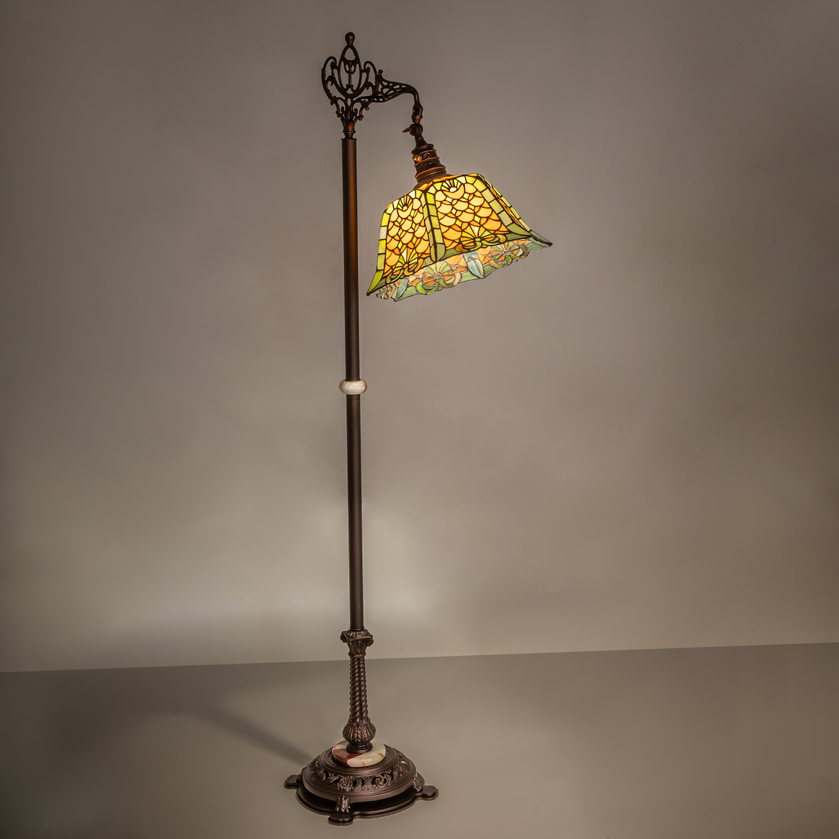 Warm ambient shot of Tiffany Shell & Diamond floor lamp glowing.