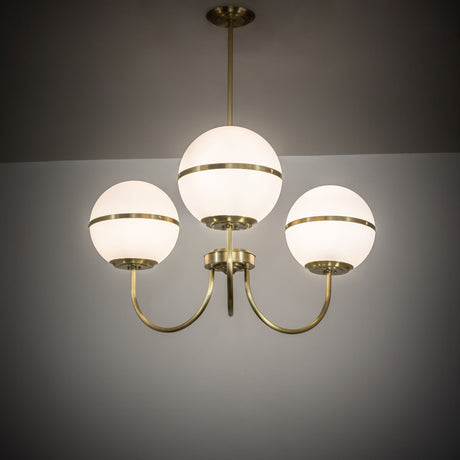 Toccata chandelier illuminated in ambient room setting.