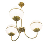 Bottom angle view of Toccata chandelier with brass arms and glass shades.