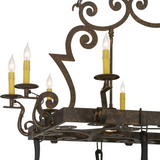 Close-up of Tourelle chandelier arm and candlelight detail.