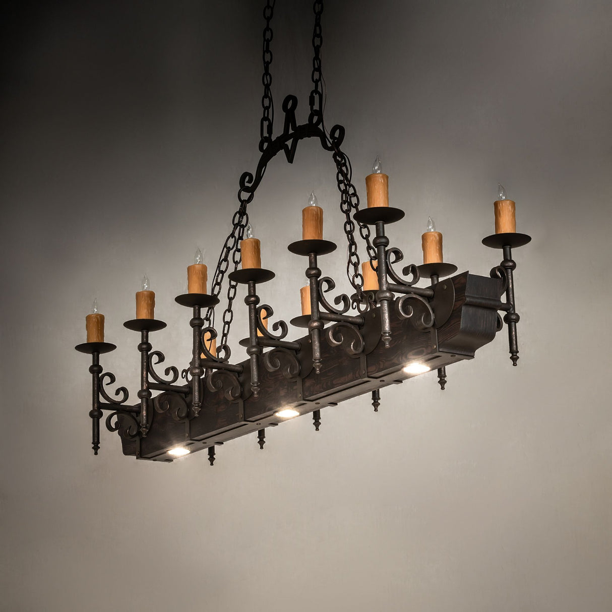 Downlight lit view of chandelier showing focused task illumination beneath the fixture.