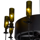 Closeup of side bottles with glowing etched grape motifs.