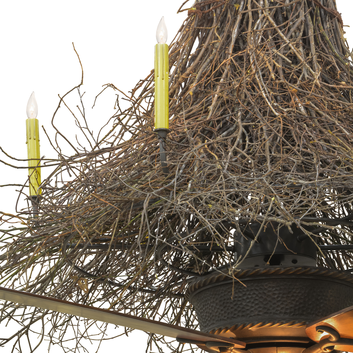 Closeup of faux candle lights emerging from handcrafted twig branches.