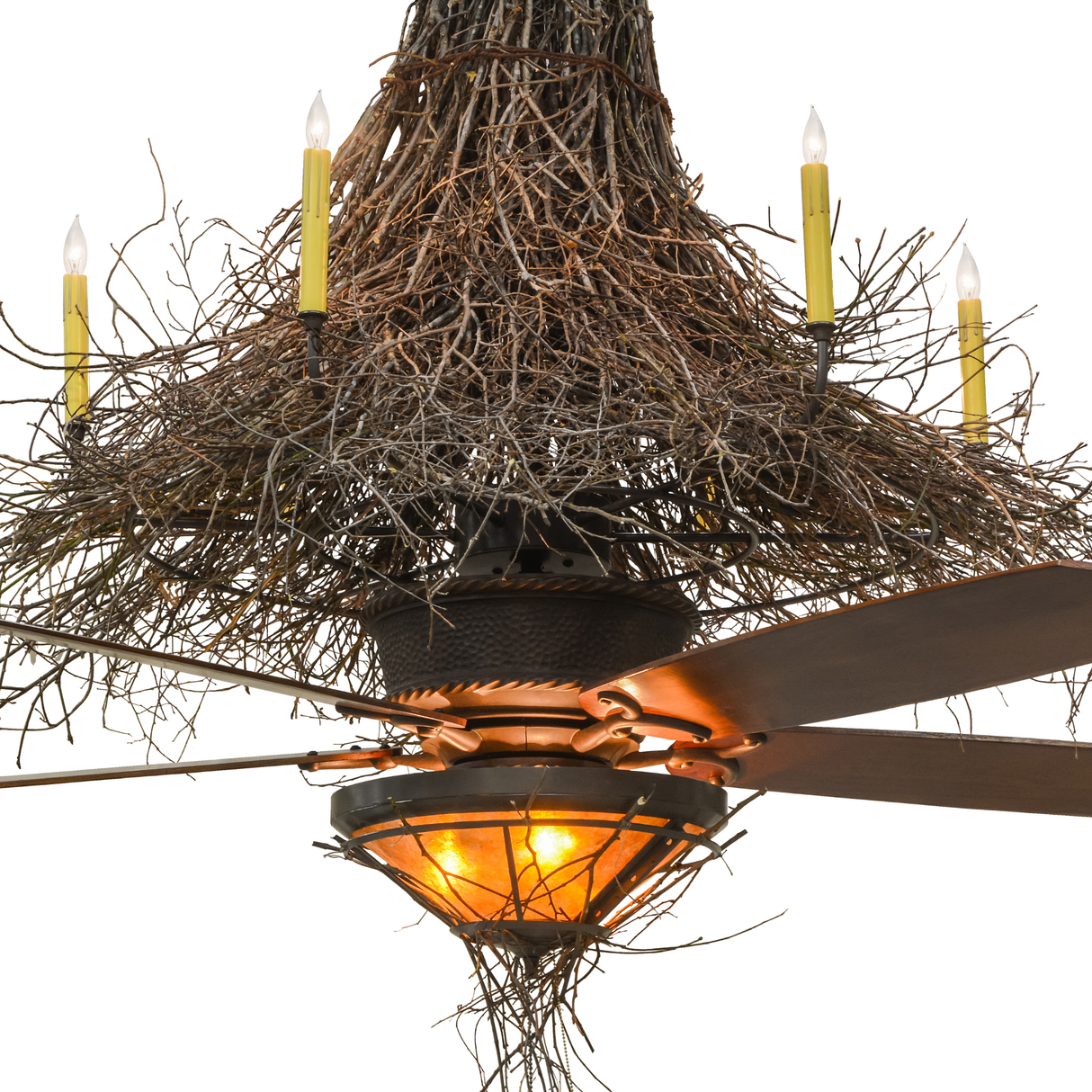 Closeup showing glowing amber mica shade and fan beneath twig canopy.