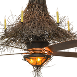 Closeup showing glowing amber mica shade and fan beneath twig canopy.
