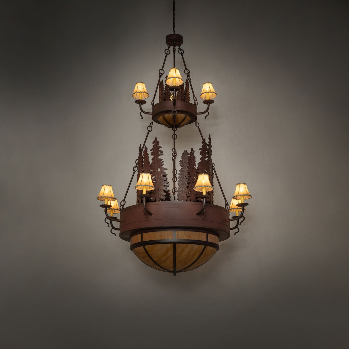 Room view of the Walden Pine chandelier illuminated by candle lights.