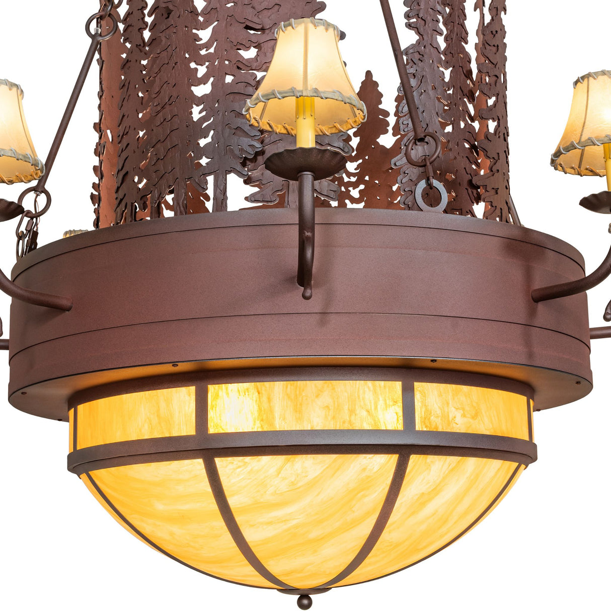 Closeup of upper tier candle shades and layered pine cut-out artistry.
