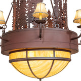 Closeup of upper tier candle shades and layered pine cut-out artistry.