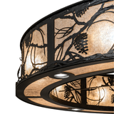 Close-up of integrated fan surrounded by illuminated mica and pinecone patterns.