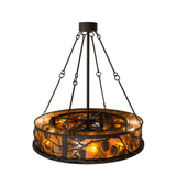 Back angled lit view showing detailed pinecone and branch cutout pattern.