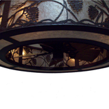 Bottom view showing integrated fan and pine motif diffuser.