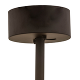 Closeup lit view capturing bronze finish and pinecone silhouette detail.